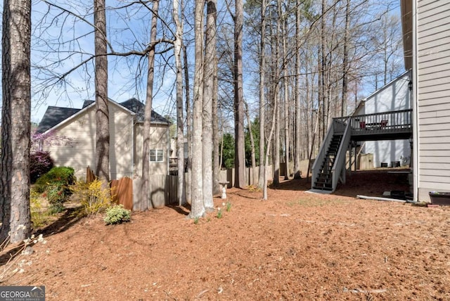 2002 Stonewick Ct, Lawrenceville, GA 30043 - view of yard with stairs and a wooden deck