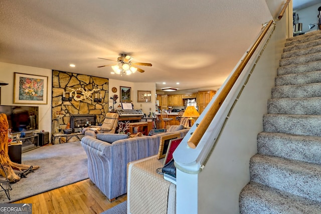 1327 Pinnacle Dr, Clayton, GA 30525 - living room with recessed lighting, light wood-style floors, a textured ceiling, stairs, and ceiling fan