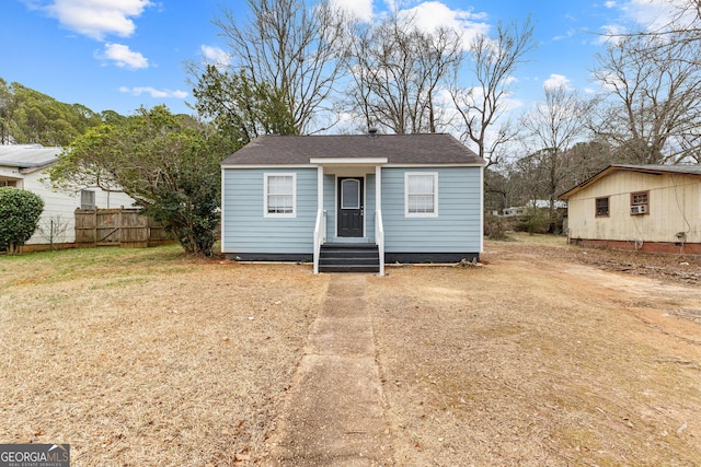 109 White Ave, Hogansville, GA 30230 - view of front of house featuring a shingled roof, dirt driveway, and fence