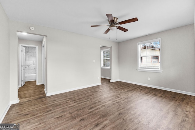 109 White Ave, Hogansville, GA 30230 - unfurnished room with a ceiling fan, dark wood-type flooring, and baseboards
