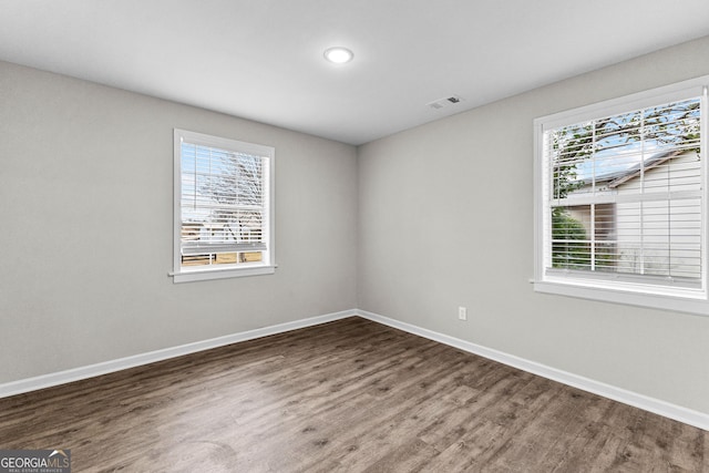 109 White Ave, Hogansville, GA 30230 - empty room featuring visible vents, baseboards, and wood finished floors