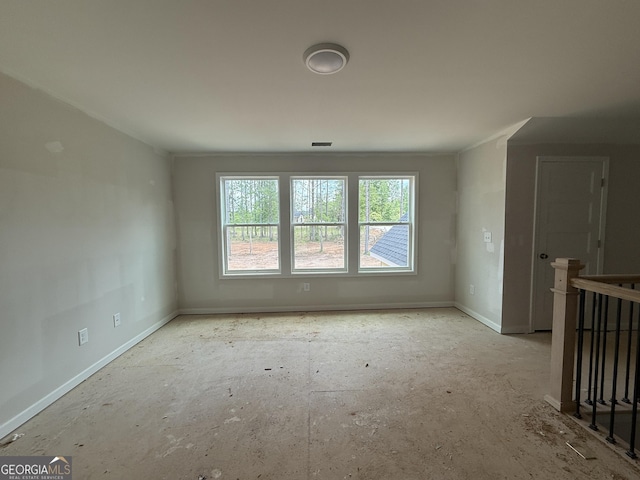empty room featuring baseboards