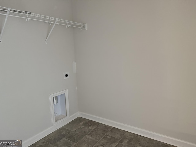 clothes washing area featuring baseboards, laundry area, and electric dryer hookup