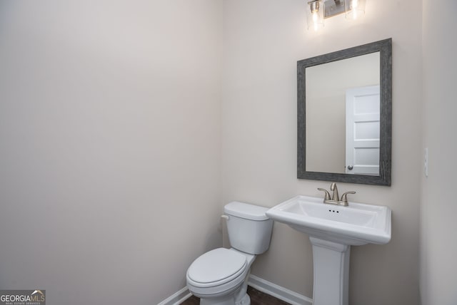 561 Jugtown Rd, Meansville, GA 30256 - bathroom with toilet and baseboards