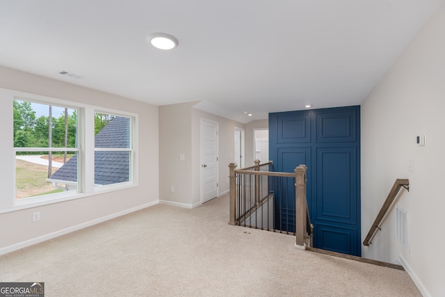 561 Jugtown Rd, Meansville, GA 30256 - empty room with carpet, baseboards, and healthy amount of natural light