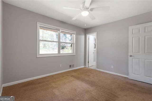 2522 Brentwood Ct, Decatur, GA 30032 - unfurnished bedroom featuring baseboards, visible vents, carpet floors, and ceiling fan