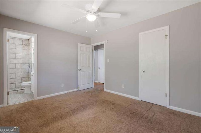 2522 Brentwood Ct, Decatur, GA 30032 - unfurnished bedroom featuring connected bathroom, a ceiling fan, baseboards, and carpet floors