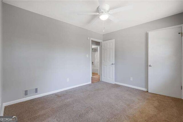 2522 Brentwood Ct, Decatur, GA 30032 - unfurnished bedroom with visible vents, baseboards, carpet, and ceiling fan