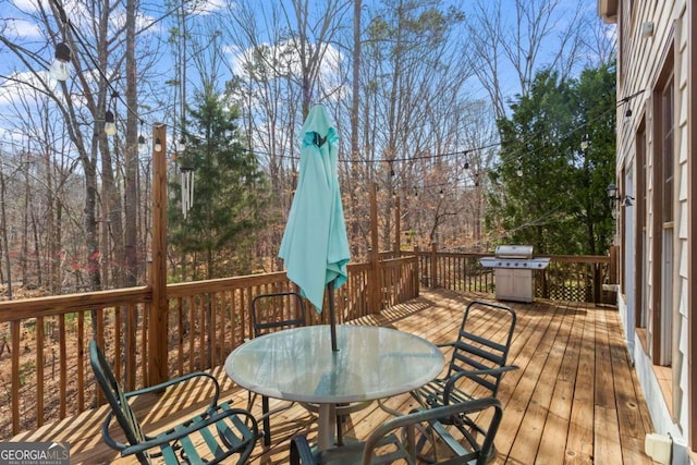 wooden deck with outdoor dining space