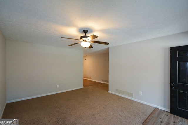 98 Brenda Cir, Rockmart, GA 30153 - unfurnished room featuring a textured ceiling, baseboards, visible vents, and ceiling fan