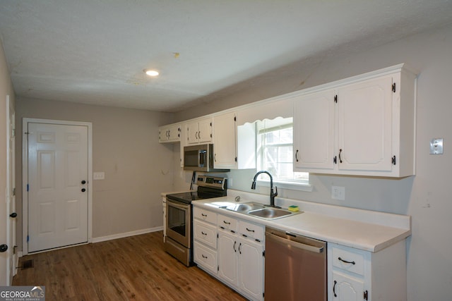 98 Brenda Cir, Rockmart, GA 30153 - kitchen featuring a sink, wood finished floors, white cabinetry, and stainless steel appliances