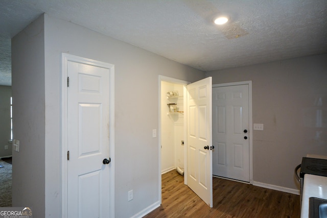 98 Brenda Cir, Rockmart, GA 30153 - interior space with a closet, a textured ceiling, baseboards, and wood finished floors