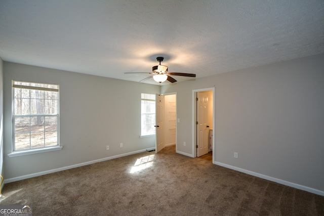 98 Brenda Cir, Rockmart, GA 30153 - unfurnished bedroom with ceiling fan, a textured ceiling, baseboards, and carpet