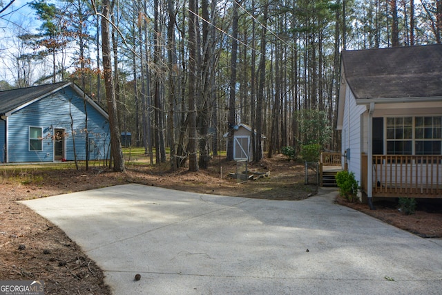 98 Brenda Cir, Rockmart, GA 30153 - exterior space featuring a deck, an outdoor structure, and a storage unit