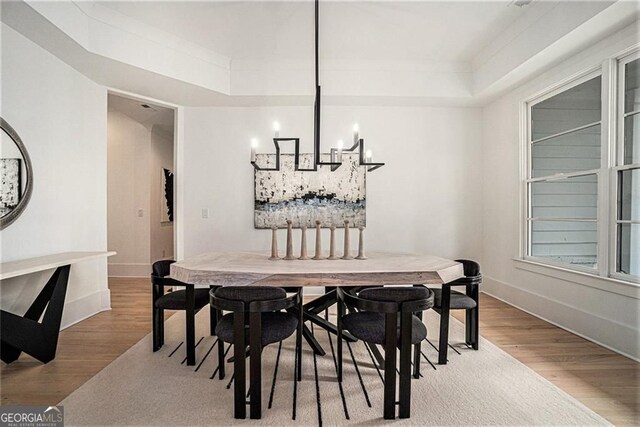 396 Academy St, Alpharetta, GA 30009 - dining space featuring a chandelier, wood finished floors, baseboards, and a raised ceiling