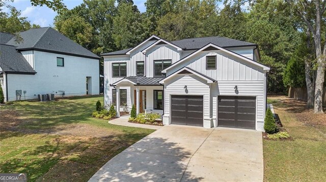 396 Academy St, Alpharetta, GA 30009 - modern farmhouse style home with board and batten siding, concrete driveway, a front lawn, a garage, and central AC