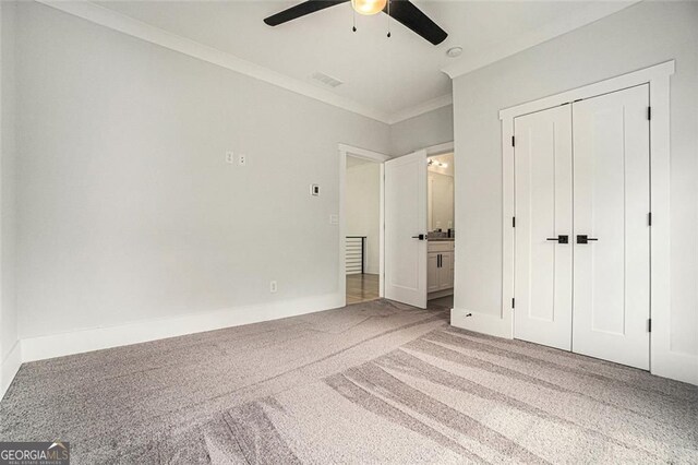 396 Academy St, Alpharetta, GA 30009 - unfurnished bedroom featuring carpet, crown molding, a closet, a ceiling fan, and baseboards