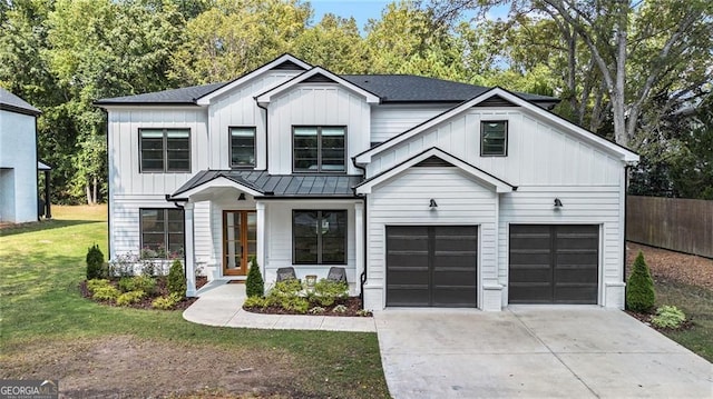 396 Academy St, Alpharetta, GA 30009 - modern farmhouse style home featuring concrete driveway, board and batten siding, a standing seam roof, an attached garage, and metal roof