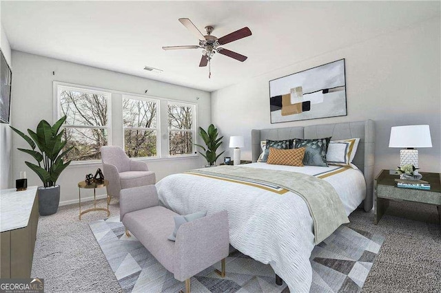 bedroom featuring visible vents, a ceiling fan, and baseboards