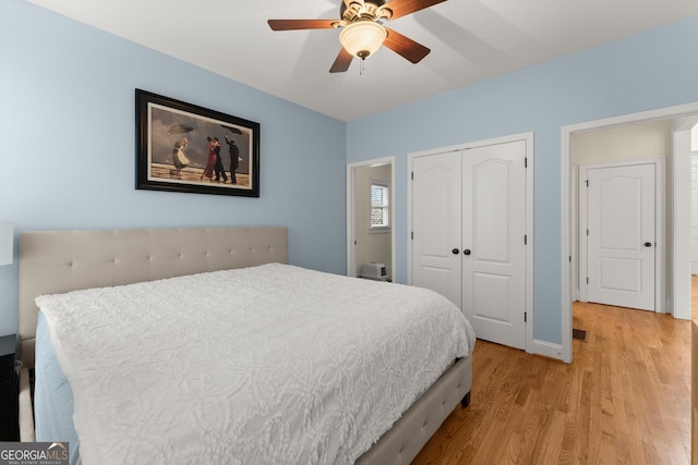 bedroom featuring visible vents, light wood-style flooring, a closet, baseboards, and ceiling fan