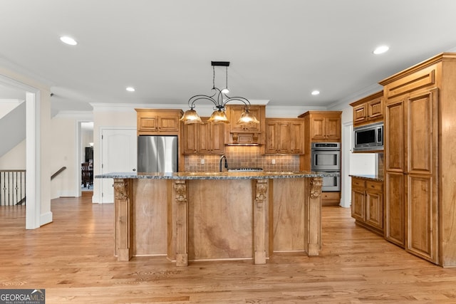 kitchen with tasteful backsplash, dark stone countertops, stainless steel appliances, and light wood-style floors