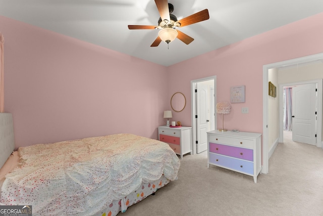 bedroom featuring light colored carpet and ceiling fan