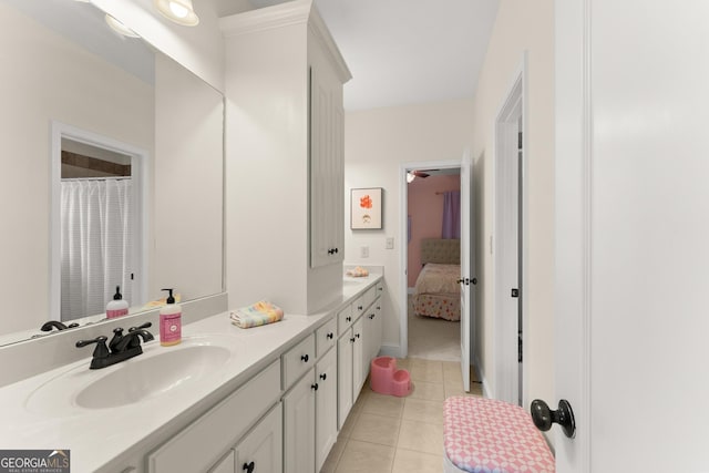 full bath featuring tile patterned flooring, vanity, and ensuite bath