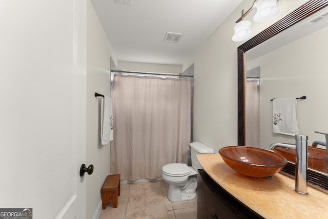 full bath with vanity, a shower with shower curtain, visible vents, tile patterned floors, and toilet