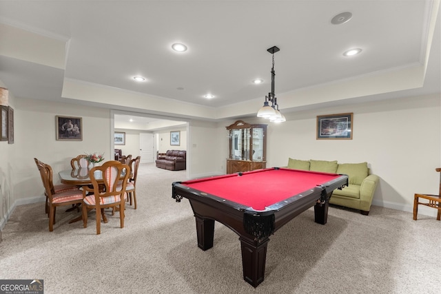 game room with crown molding, a tray ceiling, and carpet floors