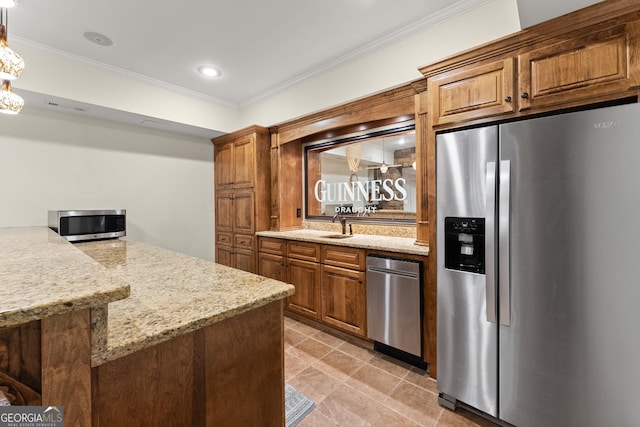 kitchen featuring light stone countertops, brown cabinetry, appliances with stainless steel finishes, and ornamental molding
