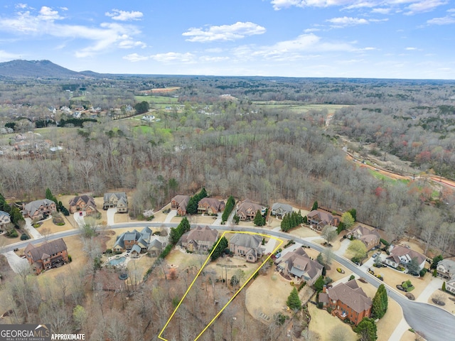 bird's eye view featuring a residential view and a view of trees