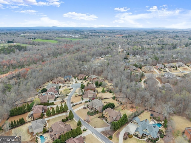 bird's eye view with a forest view and a residential view