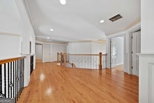 1372 Buckingham Ct, Watkinsville, GA 30677 - corridor with crown molding, an upstairs landing, light wood-type flooring, visible vents, and recessed lighting