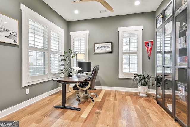 home office featuring recessed lighting, baseboards, visible vents, a ceiling fan, and wood finished floors