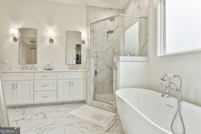 full bathroom with marble finish floor, a sink, a marble finish shower, and a freestanding bath