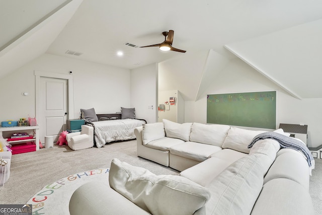 carpeted bedroom with visible vents, vaulted ceiling, and a ceiling fan
