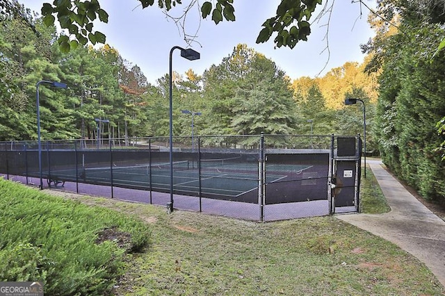 view of sport court with fence