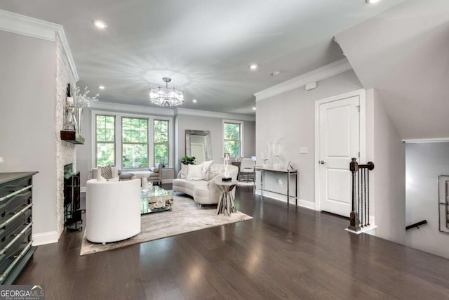 1007 Belle Ave, Roswell, GA 30076 - living room with a fireplace, an inviting chandelier, wood finished floors, and crown molding