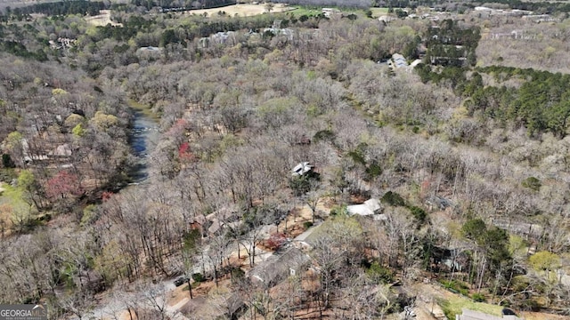 drone / aerial view featuring a forest view