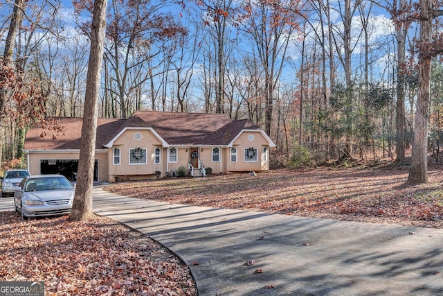 9224 Snipe Ln, Jonesboro, GA 30236 - single story home featuring driveway, stucco siding, and a shingled roof