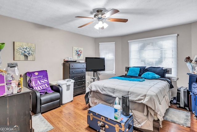 9224 Snipe Ln, Jonesboro, GA 30236 - bedroom with light wood finished floors and ceiling fan
