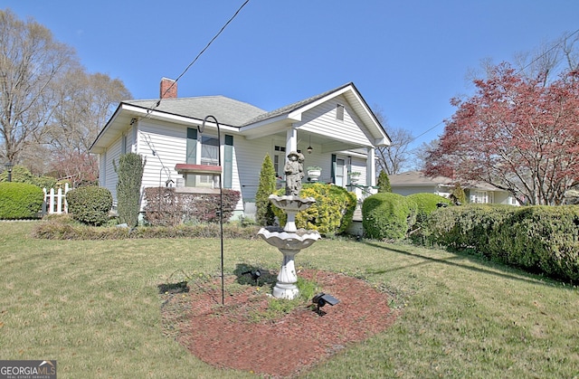 151 Flat Shoals Rd, Woodbury, GA 30293 - view of front of property featuring a chimney and a front yard