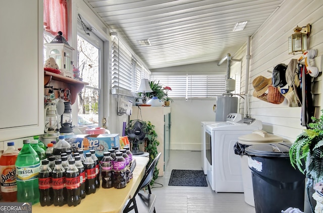 151 Flat Shoals Rd, Woodbury, GA 30293 - clothes washing area with independent washer and dryer, a healthy amount of sunlight, wood walls, and water heater