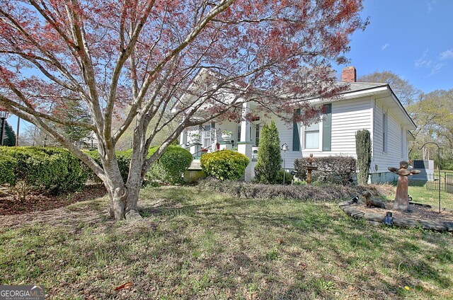 151 Flat Shoals Rd, Woodbury, GA 30293 - exterior space with a yard and a chimney