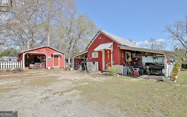 151 Flat Shoals Rd, Woodbury, GA 30293 - view of pole building featuring a yard and fence