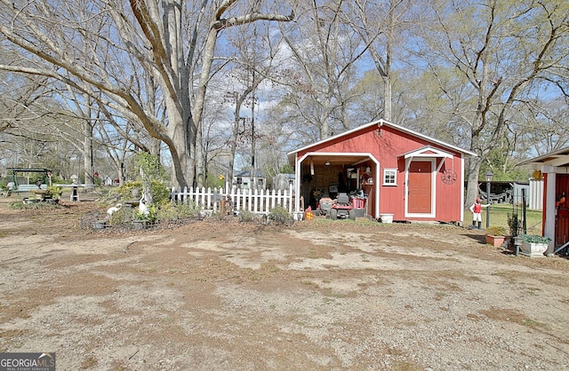 151 Flat Shoals Rd, Woodbury, GA 30293 - view of shed featuring fence