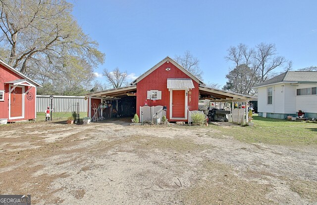 151 Flat Shoals Rd, Woodbury, GA 30293 - view of pole building featuring a carport