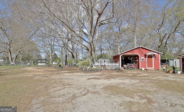 151 Flat Shoals Rd, Woodbury, GA 30293 - view of yard with an outbuilding, a pole building, and fence