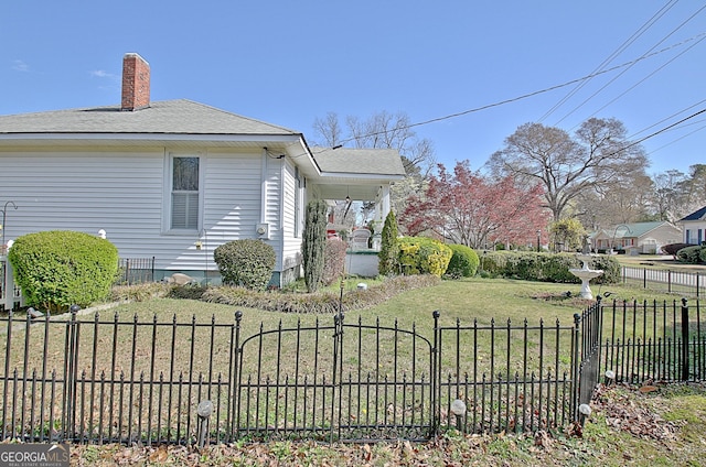 151 Flat Shoals Rd, Woodbury, GA 30293 - view of side of home with a lawn, a chimney, roof with shingles, and fence