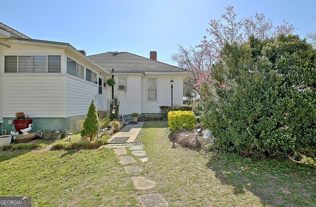 151 Flat Shoals Rd, Woodbury, GA 30293 - exterior space with a front yard and a chimney